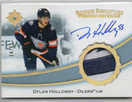  2022-23 Ultimate Collection Rookie Signature Premium Materials #RSPDH Dylan Holloway/65