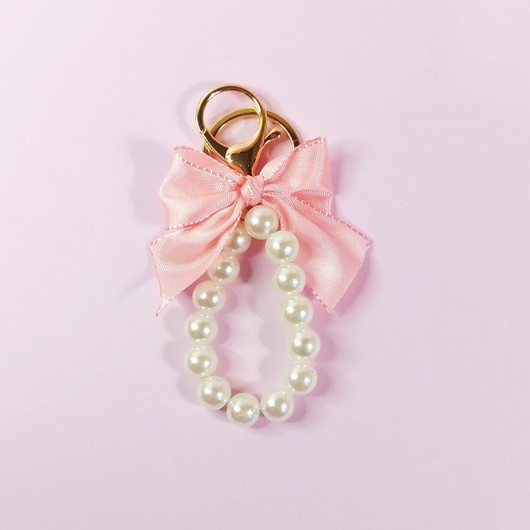 Helmi-avainkoru rusetilla