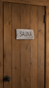 Kaiverrettu kelo sauna-kyltti